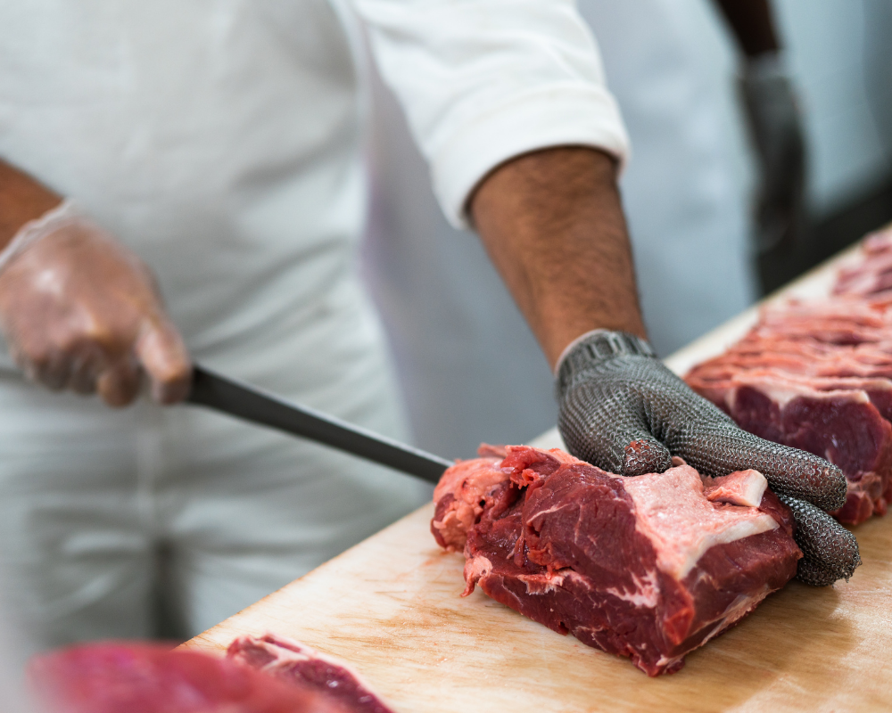 a butcher cutting meat